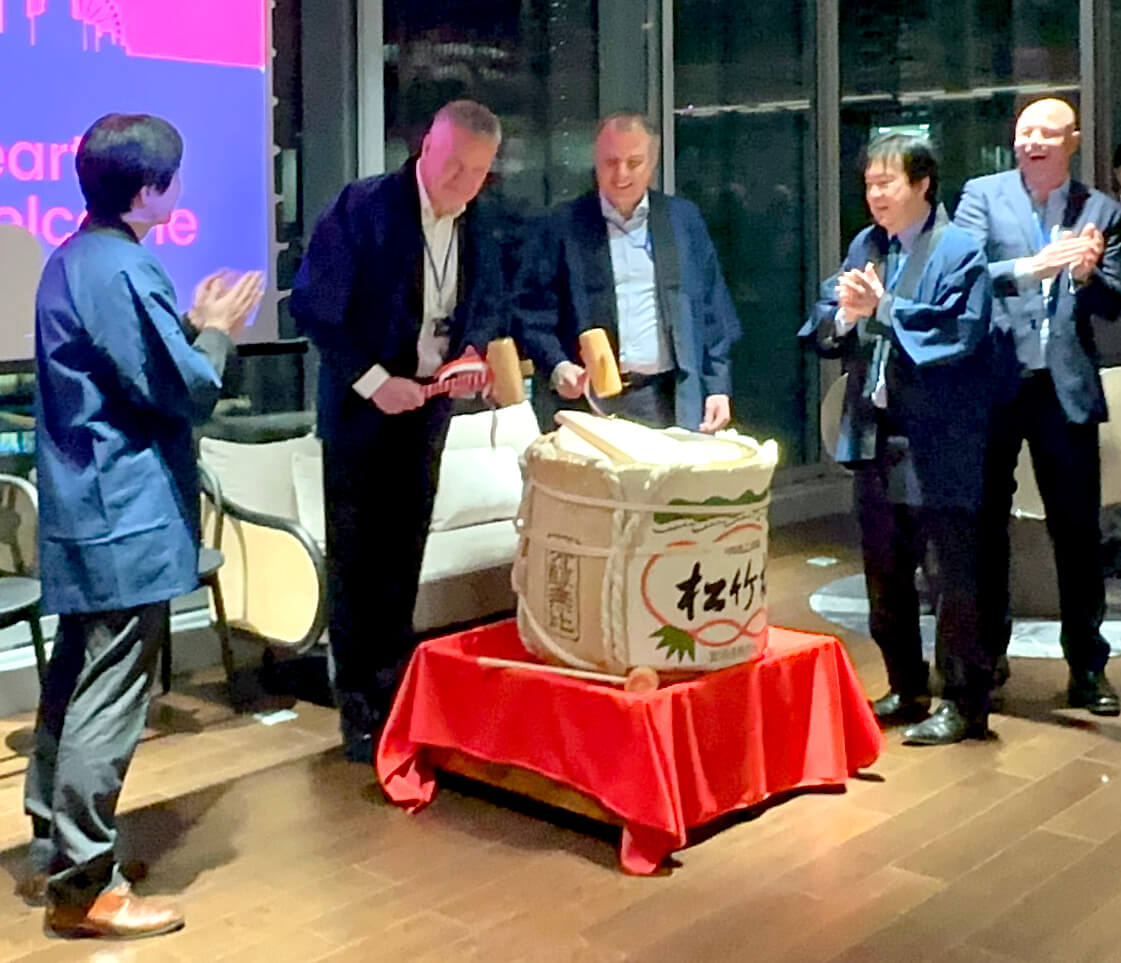 Pat Fitzgerald and Seb O'Connell break open the sake barrel at Morgan McKinley Tokyo's 20 year anniversary event